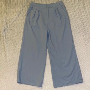 Never worn. Sky blue high waisted pants. With pleated hem.